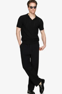 Black perforated knit polo shirt