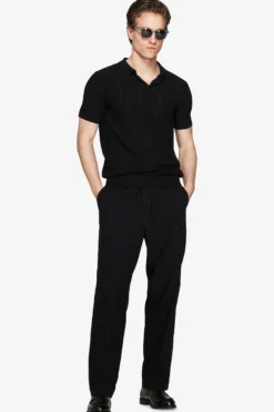Black perforated knit polo shirt