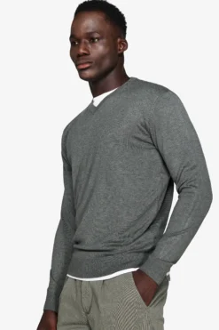 Green V-neck sweater