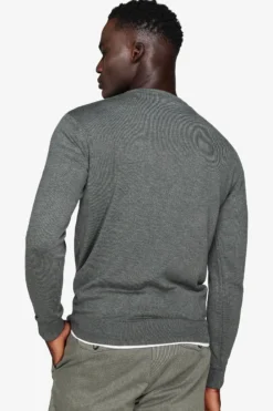 Green V-neck sweater