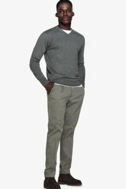 Green V-neck sweater