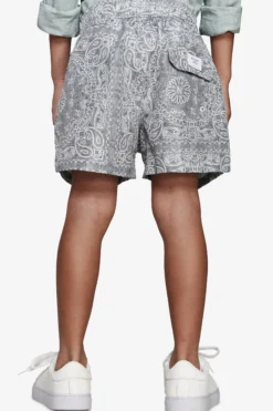 KIDS Sage floral print swim trunks
