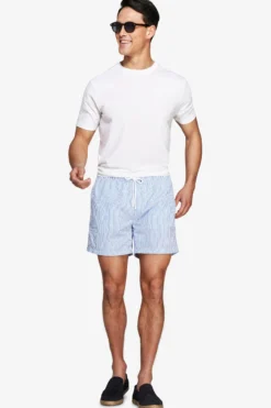 Light blue seersucker striped swim trunks