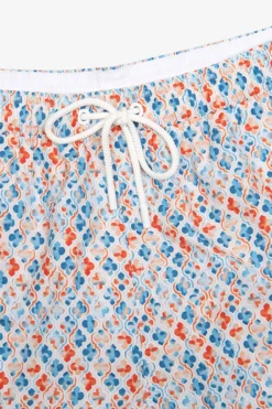 Orange lily print swim trunks