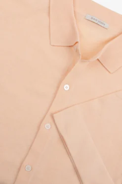 Peach short sleeved knit shirt